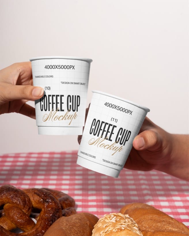 Custom-printed paper cups toasted over a café table